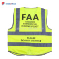 Gilet réfléchissant de sécurité de drone jaune fluorescent de 100% de polyester avec &quot;le pilote de drone commercial ne pas déranger&quot;